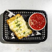 Cheesy Pesto Sticks · By Thunderbird Pies. Roasted garlic butter, brick and mozz, basil pesto, and warm tomato dip...