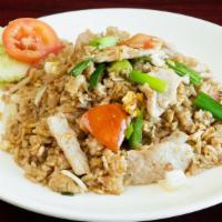 Thai Fried Rice · A traditional Thai fried rice stir-fried with diced onions, tomatoes, scallions and egg.