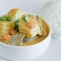 Yellow Curry · Ginger, turmeric, curry aromatics simmered in coconut milk with peas, carrots, cubed potatoe...