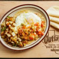 18 Huevos Rancheros · Two eggs on corn tortillas, w/cheese on refried beans, and Ranchero sauce. With home fries o...