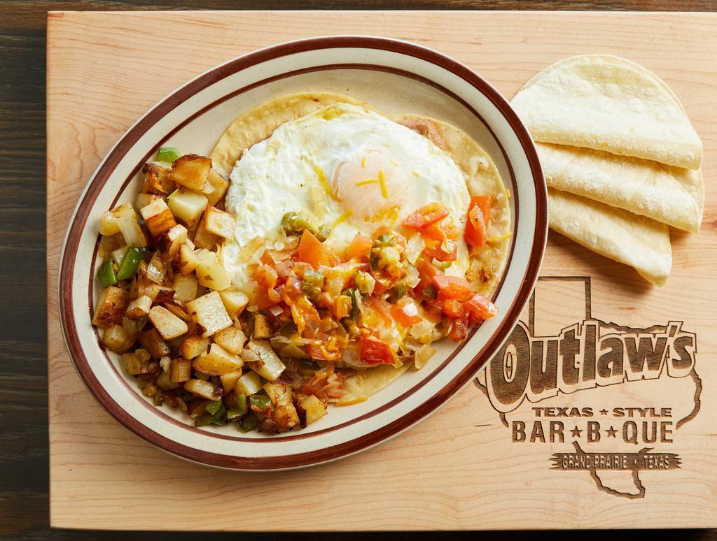 18 Huevos Rancheros · Two eggs on corn tortillas, w/cheese on refried beans, and Ranchero sauce. With home fries or hash browns,