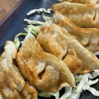 Gyoza (4Pc) · Chicken and vegetable potstickers. Side of tangy gyoza sauce.