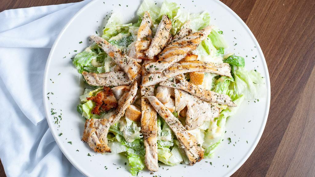 Chicken Caesar Salad · Chicken & romaine lettuce mixed with parmesan cheese, croutons, & caesar dressing.