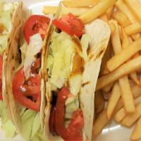 Jerk Tacos ( Chicken,Spicy) · Fresh cilantro, tomatoes, lettuce, and onions on a corn or flour tortilla with seasoned jumb...