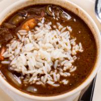 Seafood Gumbo · Traditional gumbo made with roux, okra, andouille sausage, and shrimp.