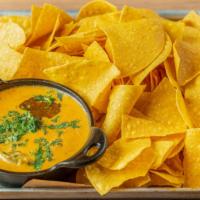 Queso Cheese Dip · Fresh salsa with jalapeños, house-made corn chips.