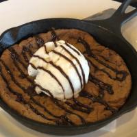 Chocolate Chunk Cookie Skillet · House-baked warm soft cookie, vanilla ice cream, chocolate sauce.
