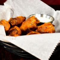 Smoked Wings · Full pound of our slow-smoked chicken wings flash-fried crispy and served naked or tossed in...