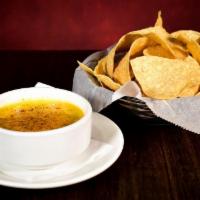 Green Chili Queso · Scratch made queso served with crispy tortilla chips. Add Firestarter Chili +.99.