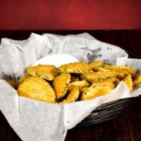 Crispy Pickle Chips · Pickle chips lightly battered, golden fried and served with Peppercorn Ranch dressing.