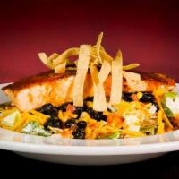 Spicy Salad · Crisp, cold greens tossed in Salsa Ranch dressing and topped with marinated grilled or fried...