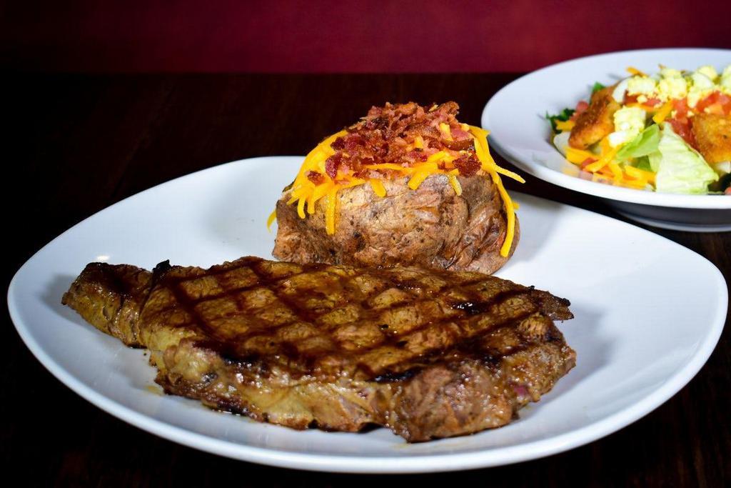 Grilled Ribeye · Hearty USDA choice ribeye aged, hand-cut, seasoned and grilled to perfection. This is our most flavorful steak. Served with your choice of two scratch made sides.
