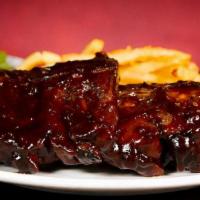 Baby Back Rib Dinner · Hearty portion of tender, fall-off-the-bone ribs specially seasoned, slow smoked and covered...