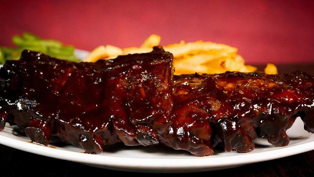 Baby Back Rib Dinner · Hearty portion of tender, fall-off-the-bone ribs specially seasoned, slow smoked and covered in our sweet tangy BBQ sauce.