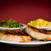 Chili Rubbed Pork Chops · Two center cut boneless pork chops topped with honey lime sauce.