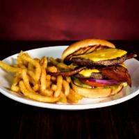 Classic Cheeseburger · Two quarter pound beef patties with American cheese. Served with french fries.