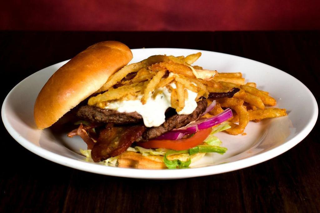 Chipotle Bleu Cheese Burger · Two quarter pound beef patties, fried onion strips, bacon, chipotle mayo & Wisconsin Bleu Cheese sauce.  Served with french fries.