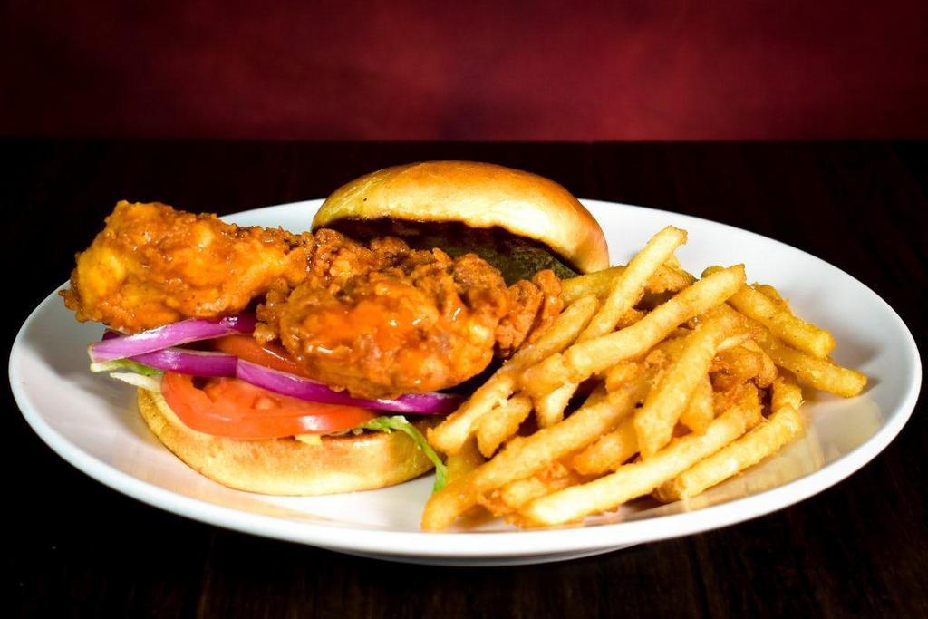 Crispy Chicken Sandwich · Hand-breaded chicken thigh fried crispy then topped with red onions, lettuce & tomato. We’ll toss it in Buffalo sauce or Black Diamond Hot sauce at no extra charge. Served with french fries.