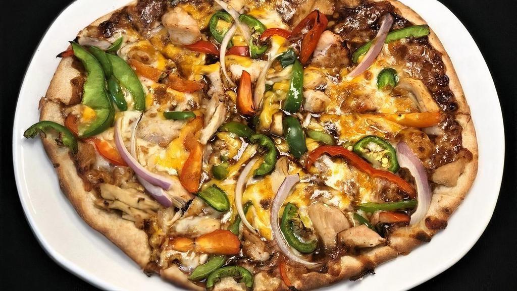 Kickin' Bbq Chicken Pizza · Grilled chicken, red onions & BBQ sauce covered in cheddar & jack cheeses then sprinkled with red peppers, green peppers & jalapeños.
