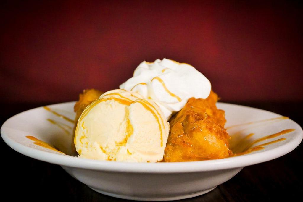 Fried Cheesecake · Lightly fried and sprinkled with cinnamon sugar then topped with vanilla ice cream, caramel sauce & whipped cream.