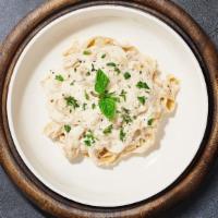 I'M Not Alfredo Pasta (Fettuccine) · Fettuccine pasta cooked in creamy white sauce, mushrooms, and aged parmesan. Served with gar...