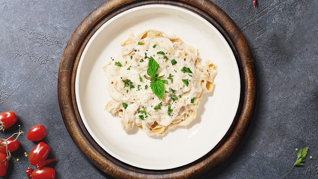 I'M Not Alfredo Pasta (Fettuccine) · Fettuccine pasta cooked in creamy white sauce, mushrooms, and aged parmesan. Served with garlic bread.