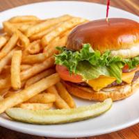 The Burger · Served with choice of one soup, salad, fries, or fresh fruit.  Add cheddar,  American, Monte...