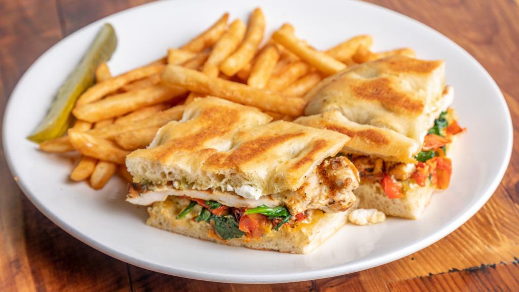 Donika'S Panini · Grilled chicken breast with roasted red peppers, spinach, roasted tomatoes, feta cheese, and pesto mayo.