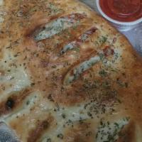 Supreme Calzone · Pepperoni, ground beef, black olives, mushrooms and onions.