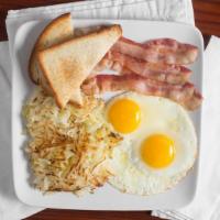 Houston Breakfast · Two eggs any style and hash browns, choice of apple wood smoked bacon, turkey sausage, chick...