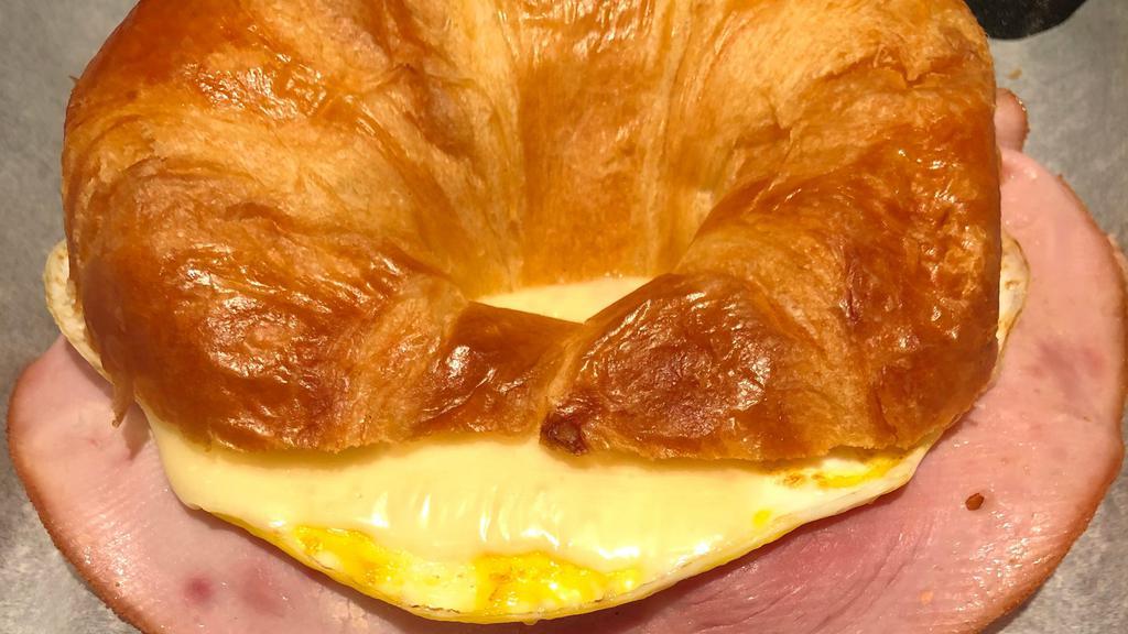 Breakfast Ham Croissant · HamEgg, and melted
American Swiss Cheese on a lightly
toasted fresh croissant