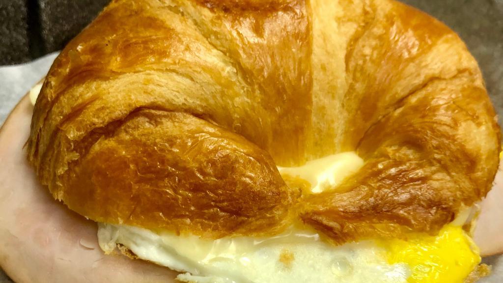 Breakfast Turkey Croissant · Turkey,Egg, and melted
American Swiss Cheese on a lightly
toasted fresh croissant
