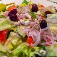 Greek Salad · Fresh cut Romaine Lettuce, Tomatoes, Cucumbers, Red Onions, Pepperoncini, Kalamata Greek Oli...