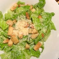 Caesar Salad · Fresh cut romaine Lettuce hand-tossed in Caesar Dressing topped with Croutons & Parmesan Che...