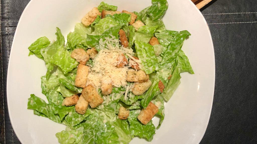 Caesar Salad · Fresh cut romaine Lettuce hand-tossed in Caesar Dressing topped with Croutons & Parmesan Cheese