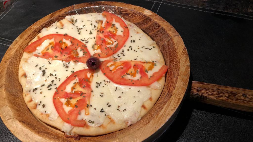 Margarita Pizza · Sauce-less flat-bread pizza with Mozzarella cheese, Fresh Tomatoes, Virgin Olive Oil, Garlic, and Basil