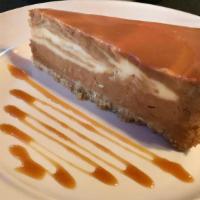 Salted Caramel Cheesecake · NY plain cheesecake swirled in thick, rich, Dulce de Leche, topped with a thin layer of Cara...
