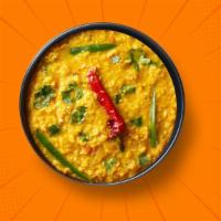 Light Yellow Dal  · Slow-cooked lentil, tempered with tomatoes, onions, green chilis, and Indian spices. Served ...