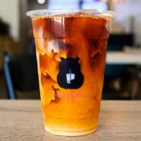 Thai Tea · A smokey, caffeinated black tea made with creamer served cold, but equally delicious served ...