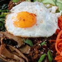 Double Meat Bibimbap · Your choice of 2 proteins with white rice, kimchi, shredded carrots, cucumber, scallions, se...