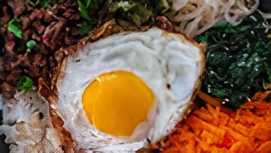 Triple Meat Bibimbap · Your choice of 3 proteins with white rice, kimchi, shredded carrots, cucumber, scallions, sesame seeds, fried egg, and gochujang.