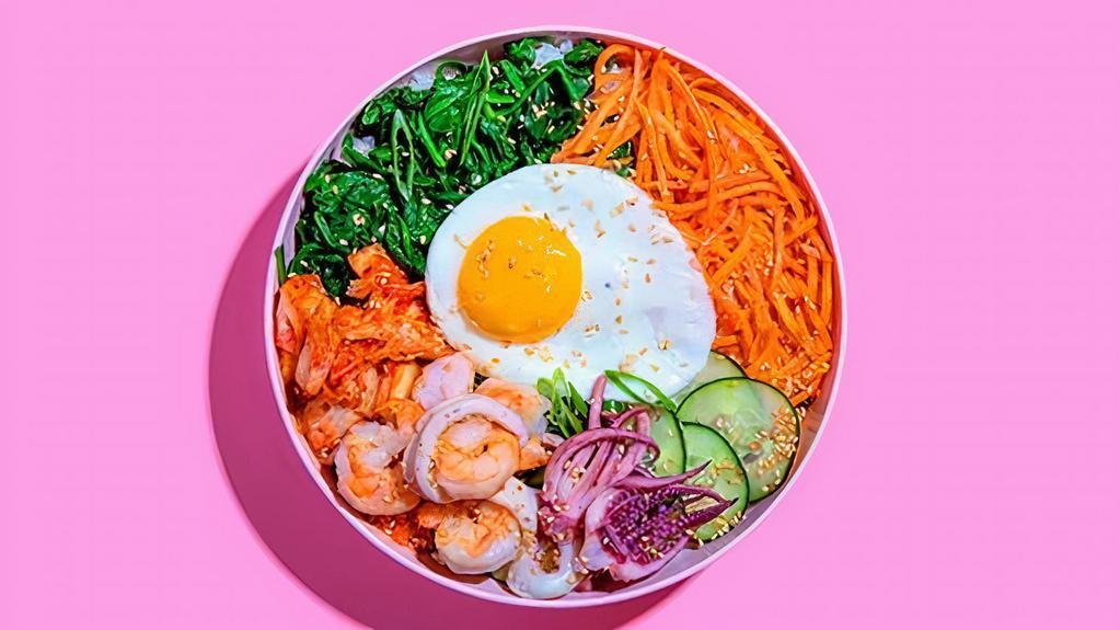 Seafood Bibimbap · Shrimp and tuna with white rice, kimchi, shredded carrots, cucumber, scallions, sesame seeds, fried egg, and gochujang.