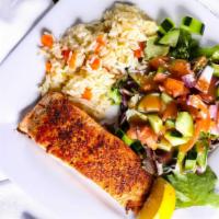 Grilled Salmon Fillet · Fresh salmon, served with rice and garden salad.