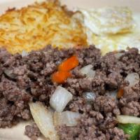 Huevos Con Picadillo · Two farm-fresh eggs prepared with ground beef, pepper, tomatoes, and onions. Served with has...