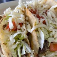 Shredded Beef Taco Plate · Three shredded beef tacos. Served with rice and refried beans.