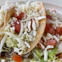 Ground Beef Taco Plate · Three ground beef tacos. Served with rice and refried beans.