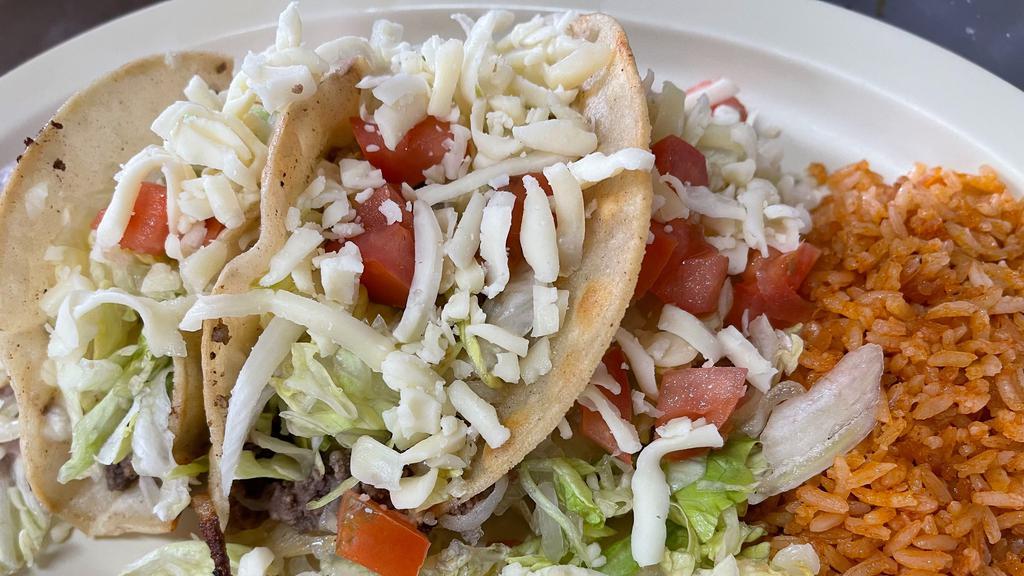 Ground Beef Taco Plate · Three ground beef tacos. Served with rice and refried beans.