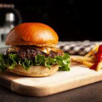 Rodeo Burger · flame grilled beef patty with Swiss Cheese, Lettuce, Caramelized Onions, Tomatoes, Pickles, ...