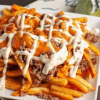 Beef House Fries · Chopped beef burger topped and  Fanoosh sauce.