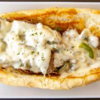 Philly & Cheese · Prime Philly beef on a hoagie roll, choice of two cheese, grilled onion, grilled peppers, an...